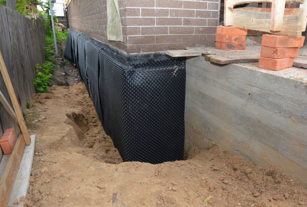 SJ Waterproofing Pros technician performing targeted Waterproofing assessment in Vanlue, OH